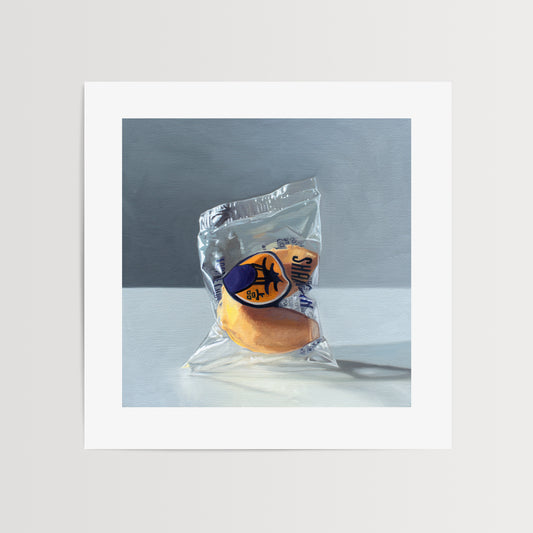 Fortune Cookie Fine Art Print by Lauren Pretorius: a single fortune cookie standing with dramatic side lighting and cast shadows on a light, reflective surface with a darker grey background.