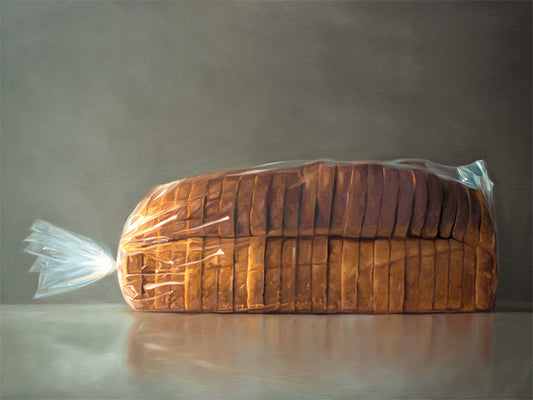 Fresh Bread Loaf Fine Art Print by Lauren Pretorius: a fresh loaf of bread in clear plastic wrap on a medium grey background.