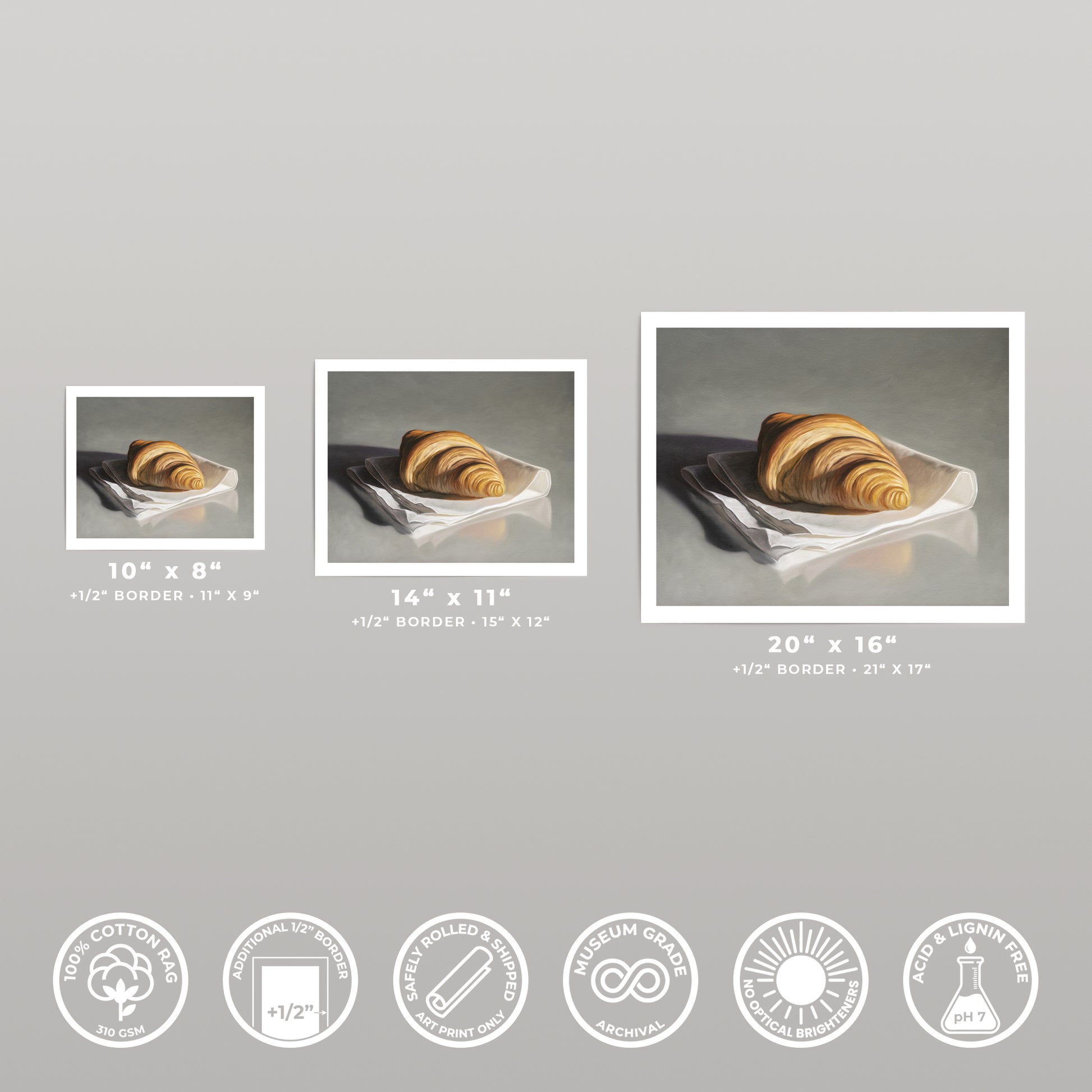 Three sizes of a "Fresh Croissant" fine art print on cotton rag paper, showing a realistic croissant on a white napkin.