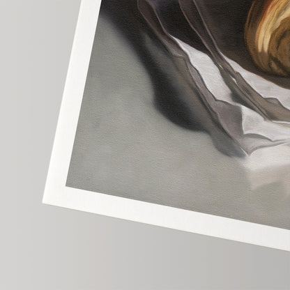 Fine art print of a golden croissant on white paper with a crisp white border.