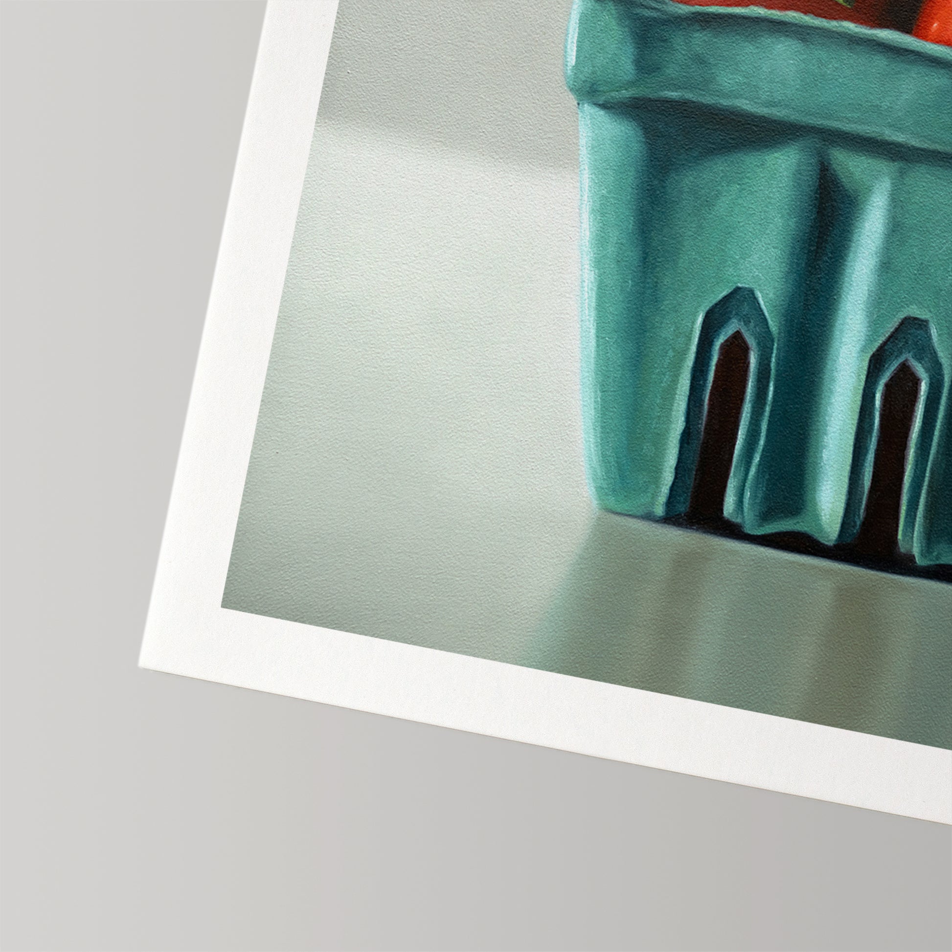 Fine art print of vibrant red tomatoes in a teal berry basket, on museum-grade cotton rag paper with a white border.