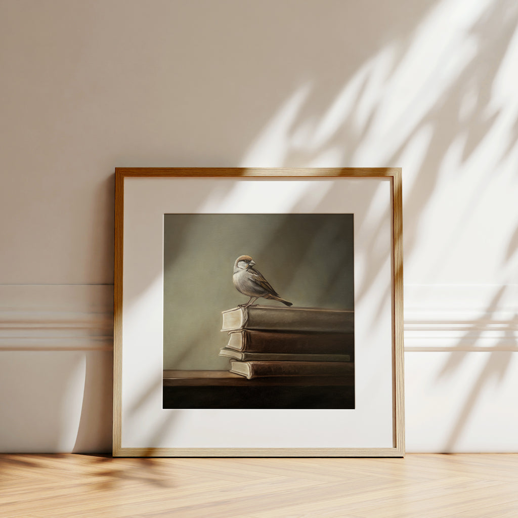 This artwork features a male sparrow perched on the edge of a stack of vintage books.