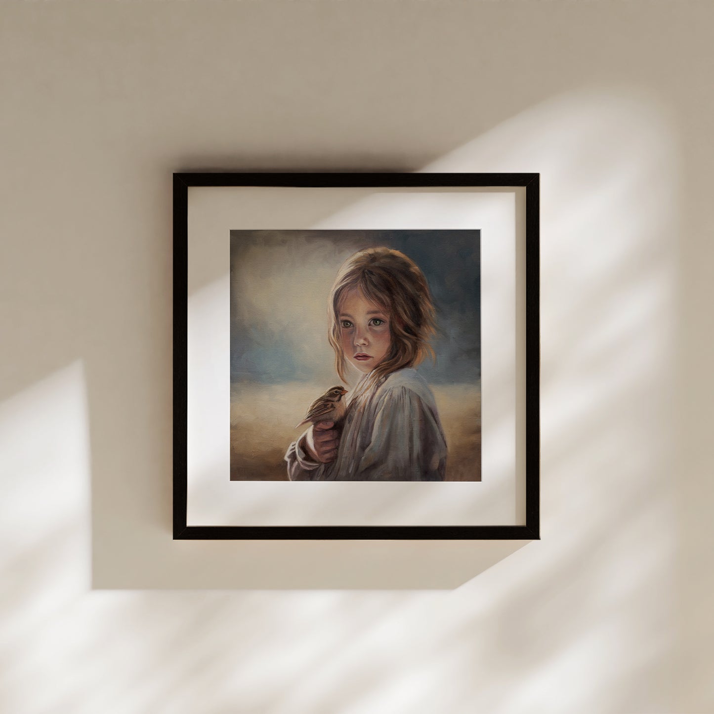 Girl with Sparrow Fine Art Print by Lauren Pretorius: a young girl holding a bird with a soft, warm color palette.