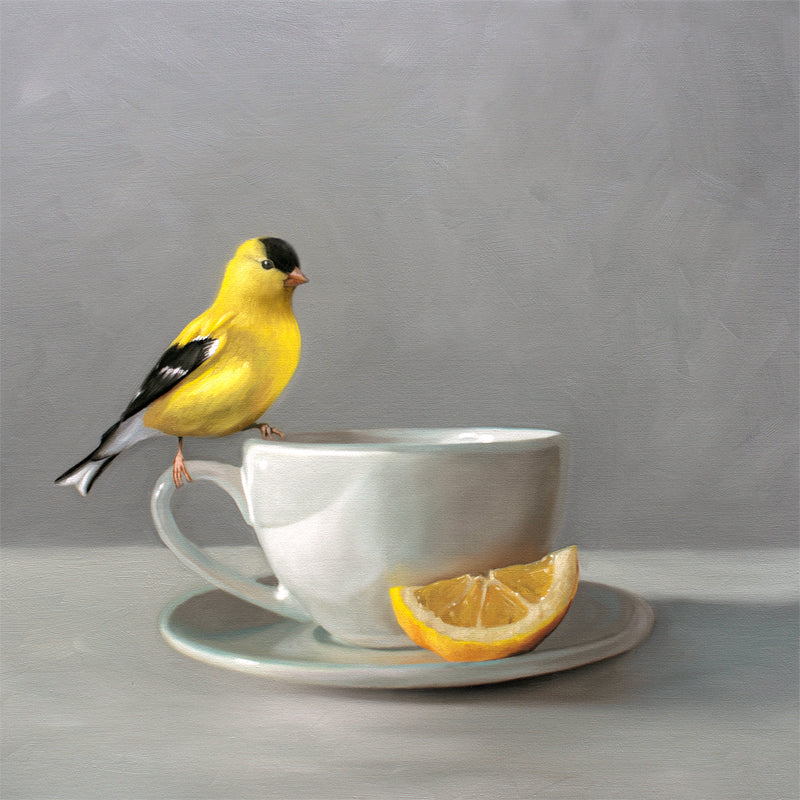 Fine art print of a vibrant yellow goldfinch perched on a white teacup with a lemon slice.
