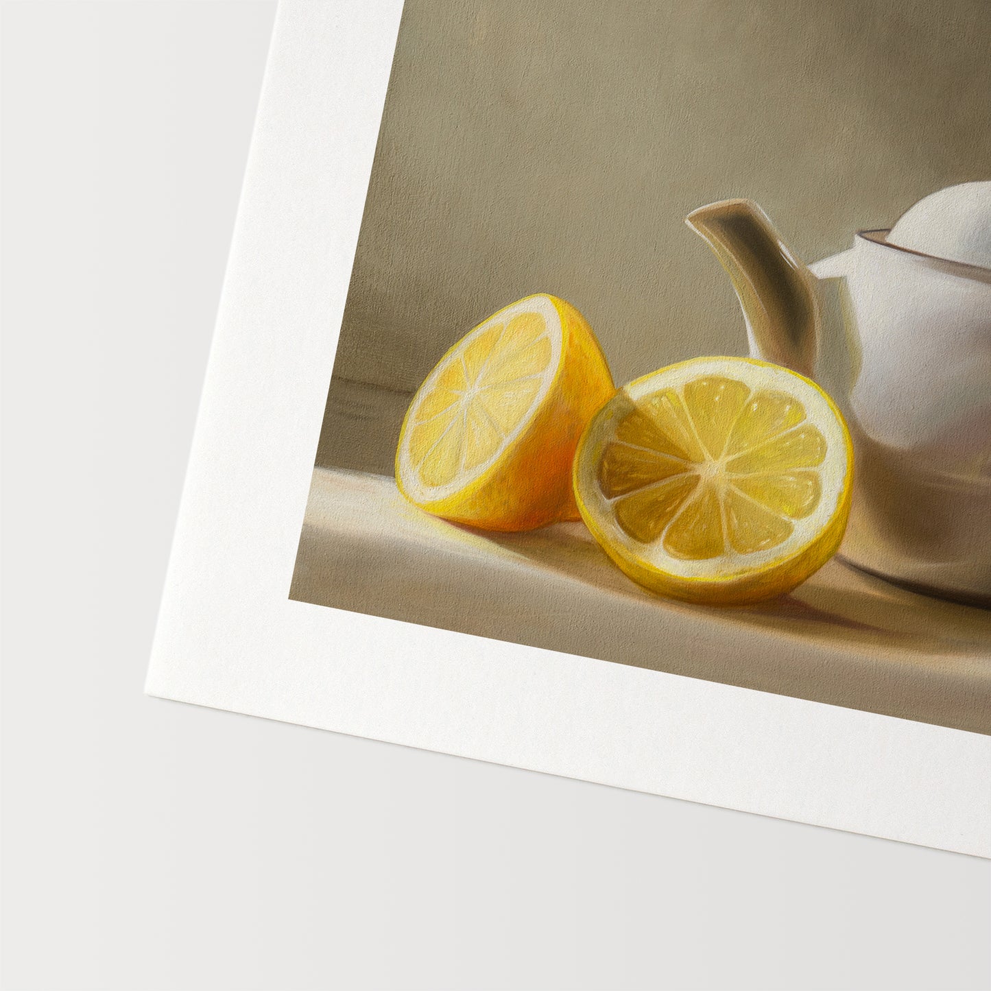 Goldfinch & Teapot Fine Art Print by Lauren Pretorius: a goldfinch perched on the handle of a teapot with two lemons on the left.