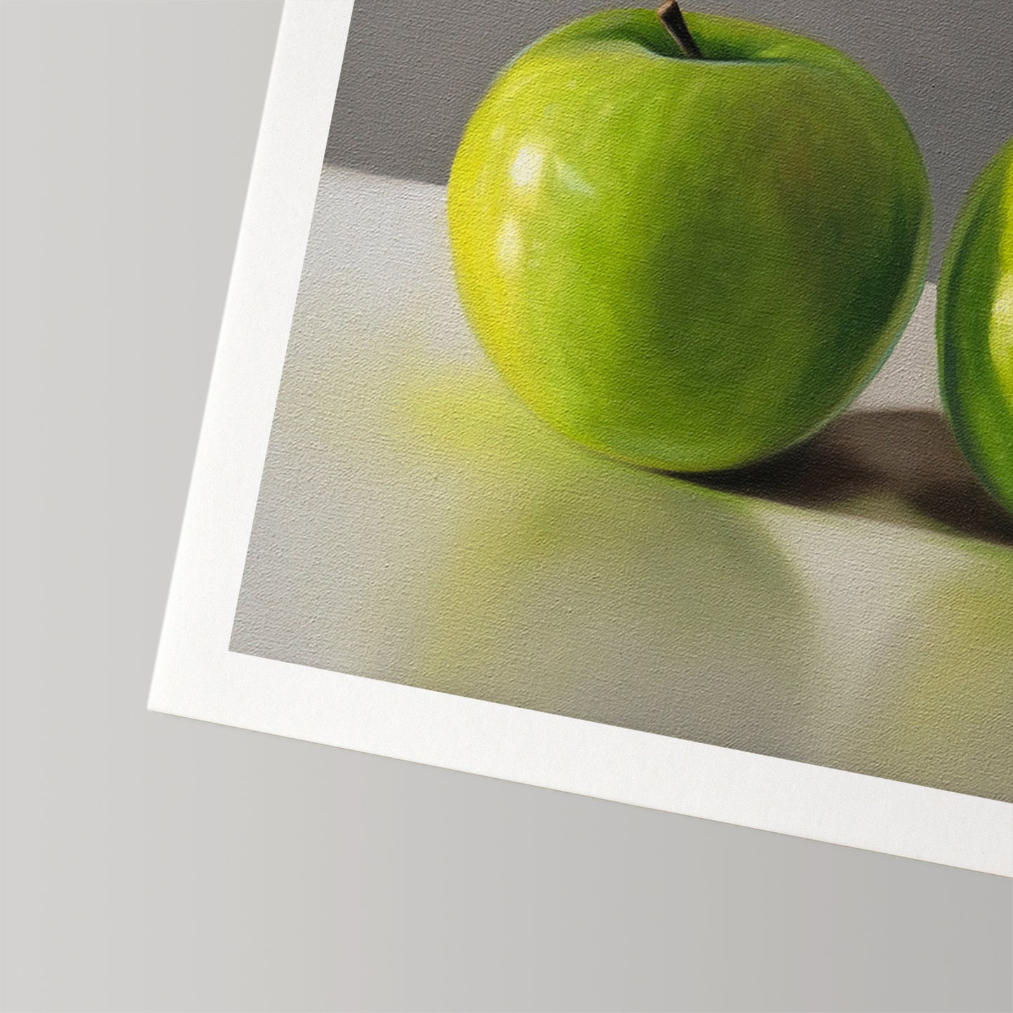 Vibrant green apple fine art print on museum-grade cotton rag paper with a white border.