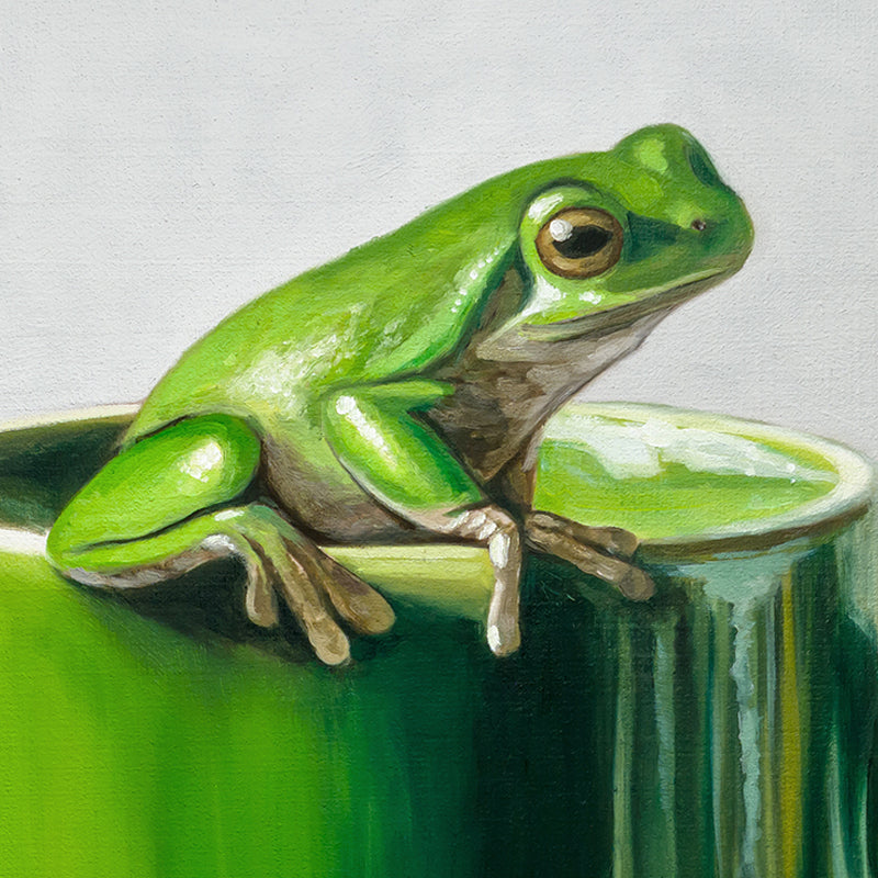 Green Frogs & Cup 12" x 12" Original Oil Painting by Lauren Pretorius: a green ceramic mug with a frog design on a light gray background