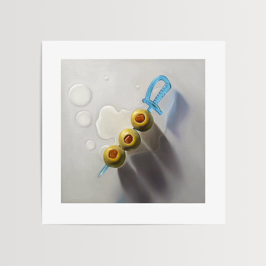 Green Olives & Sword Fine Art Print by Lauren Pretorius: a trio of green olives on a blue cocktail sword with some nice dramatic lighting.
