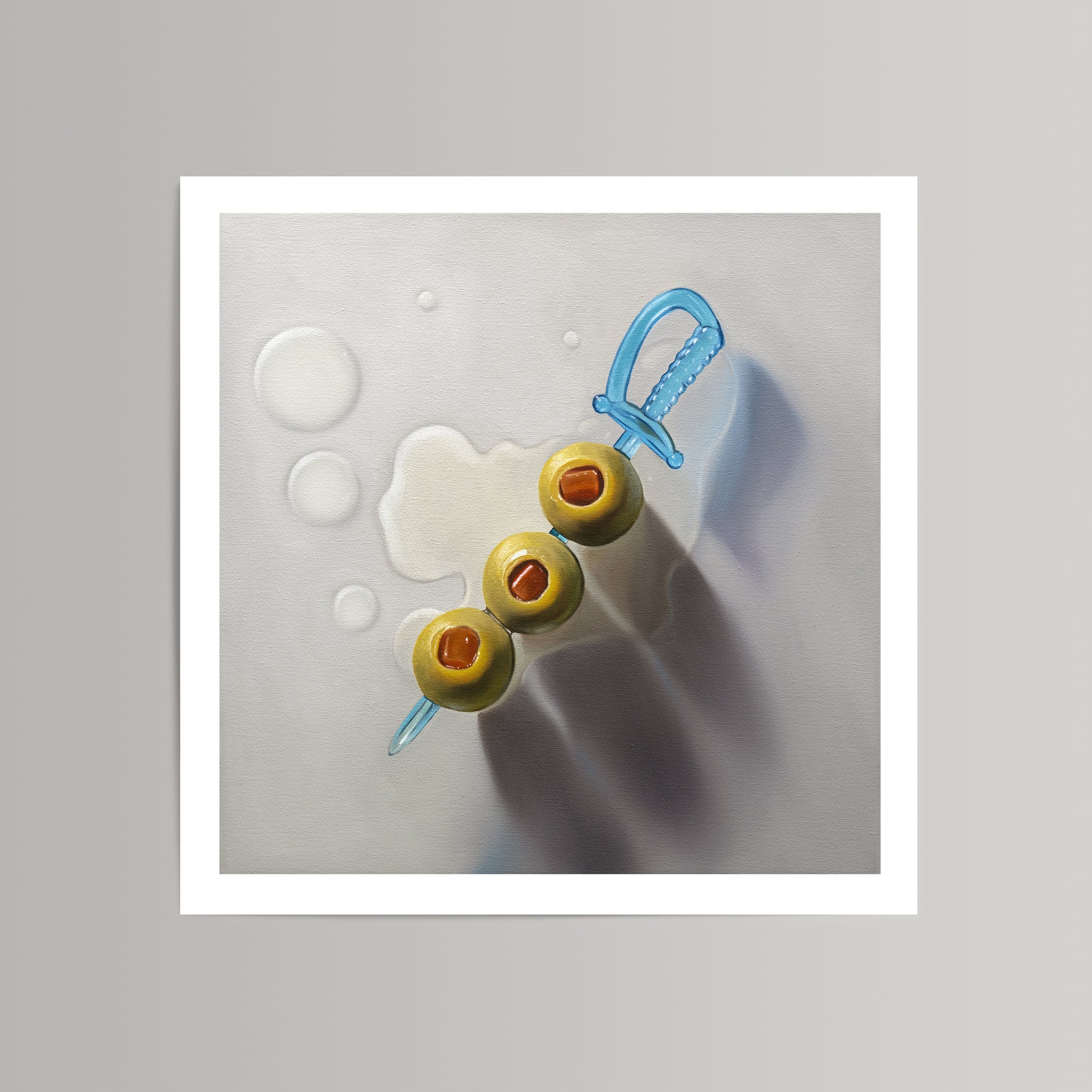 Realistic art print of three green olives on a blue plastic sword pick, with liquid drops on a white background.