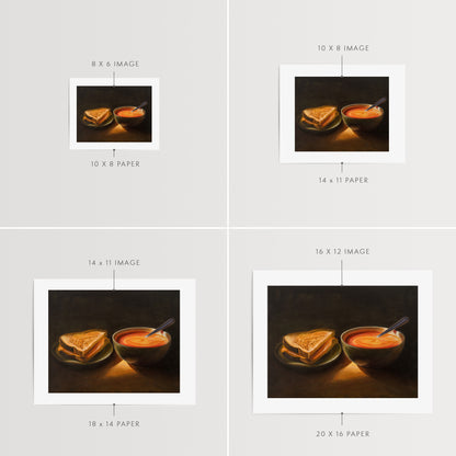Grilled Cheese & Tomato Soup Fine Art Print by Lauren Pretorius: a bowl of tomato soup and a grilled cheese sandwich, with a spoon resting in the soup.