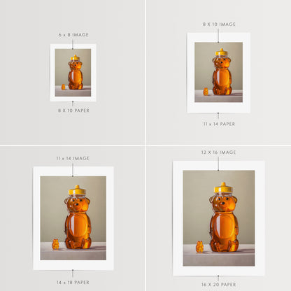 Gummy Bear & Honey Bear Fine Art Print by Lauren Pretorius: a honey bear jar with a gummy bear on a neutral background