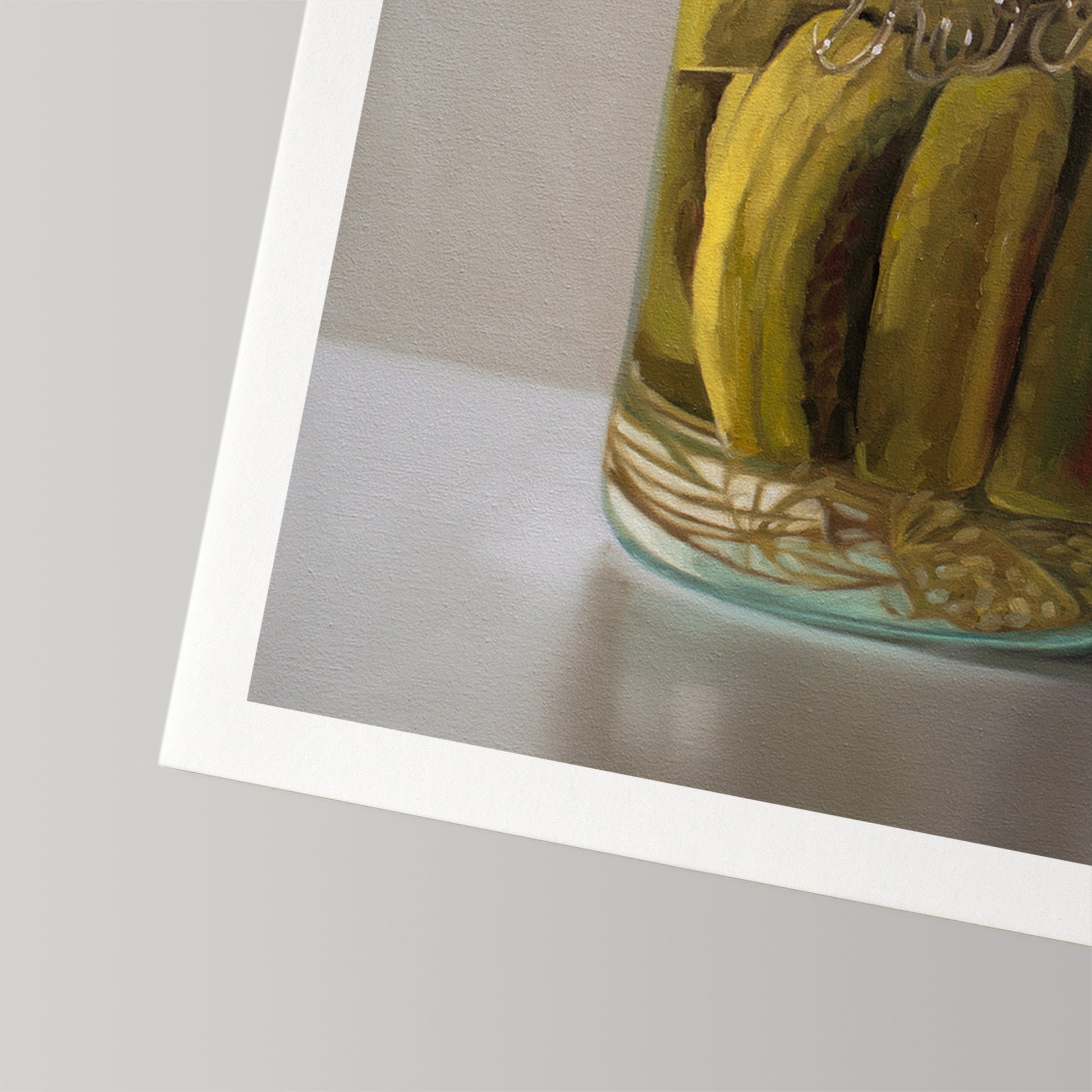 Vibrant fine art print of homemade pickles in a glass jar, featuring a white border on cotton rag paper.