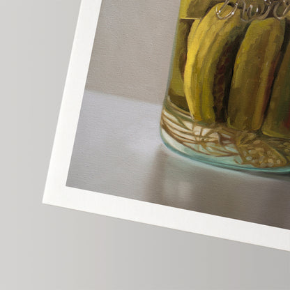 Vibrant fine art print of homemade pickles in a glass jar, featuring a white border on cotton rag paper.