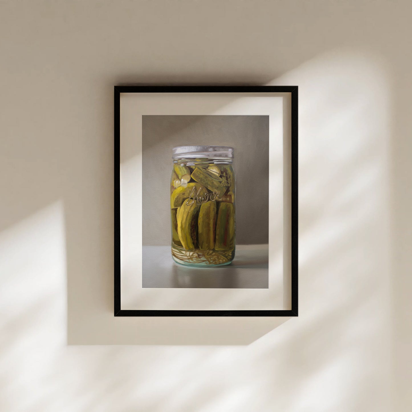 Framed fine art print of a realistic painting featuring a clear mason jar filled with green homemade pickles.