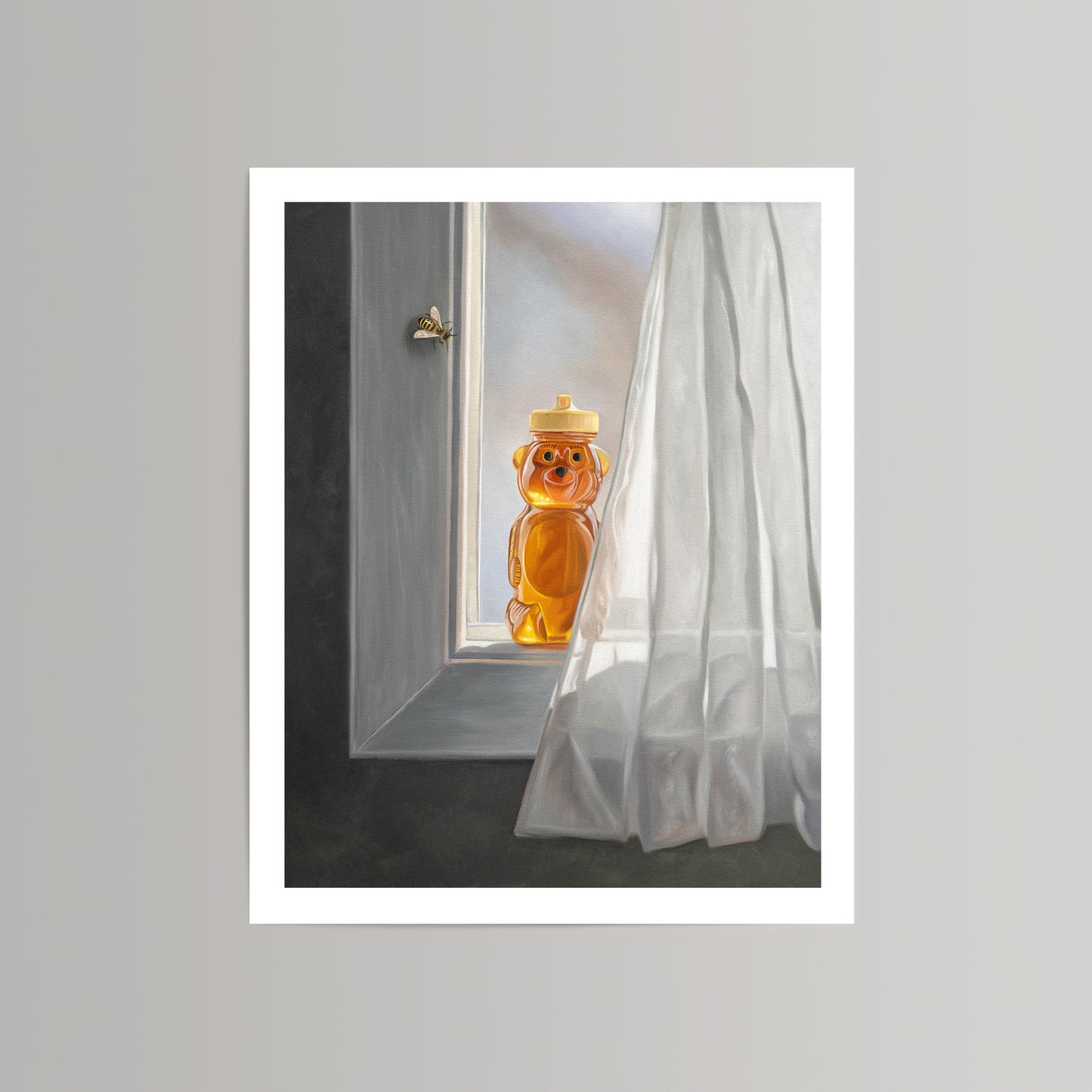 Fine art print of a honey bear jar on a sunlit window sill with a bee flying nearby and white curtain.