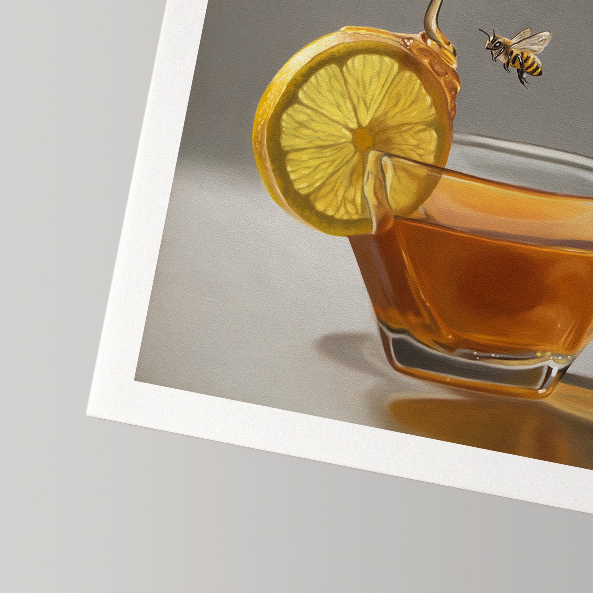 Vibrant fine art print of a lemon slice on a glass of tea with dripping honey and a bee.