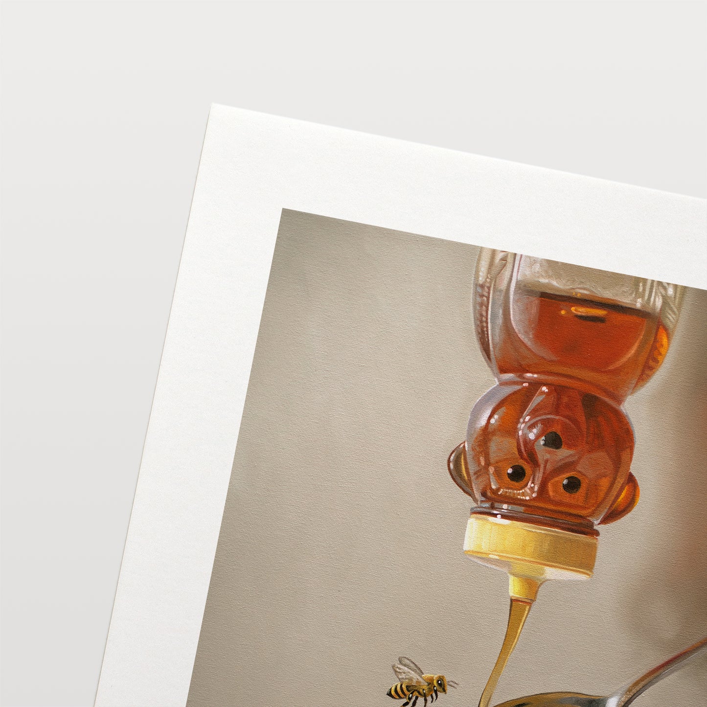 Honey, Bee, Spoon & Tea Fine Art Print by Lauren Pretorius: a classic honey bear bottle turned upside down whilst golden honey spills into a spoon and cup of tea below.