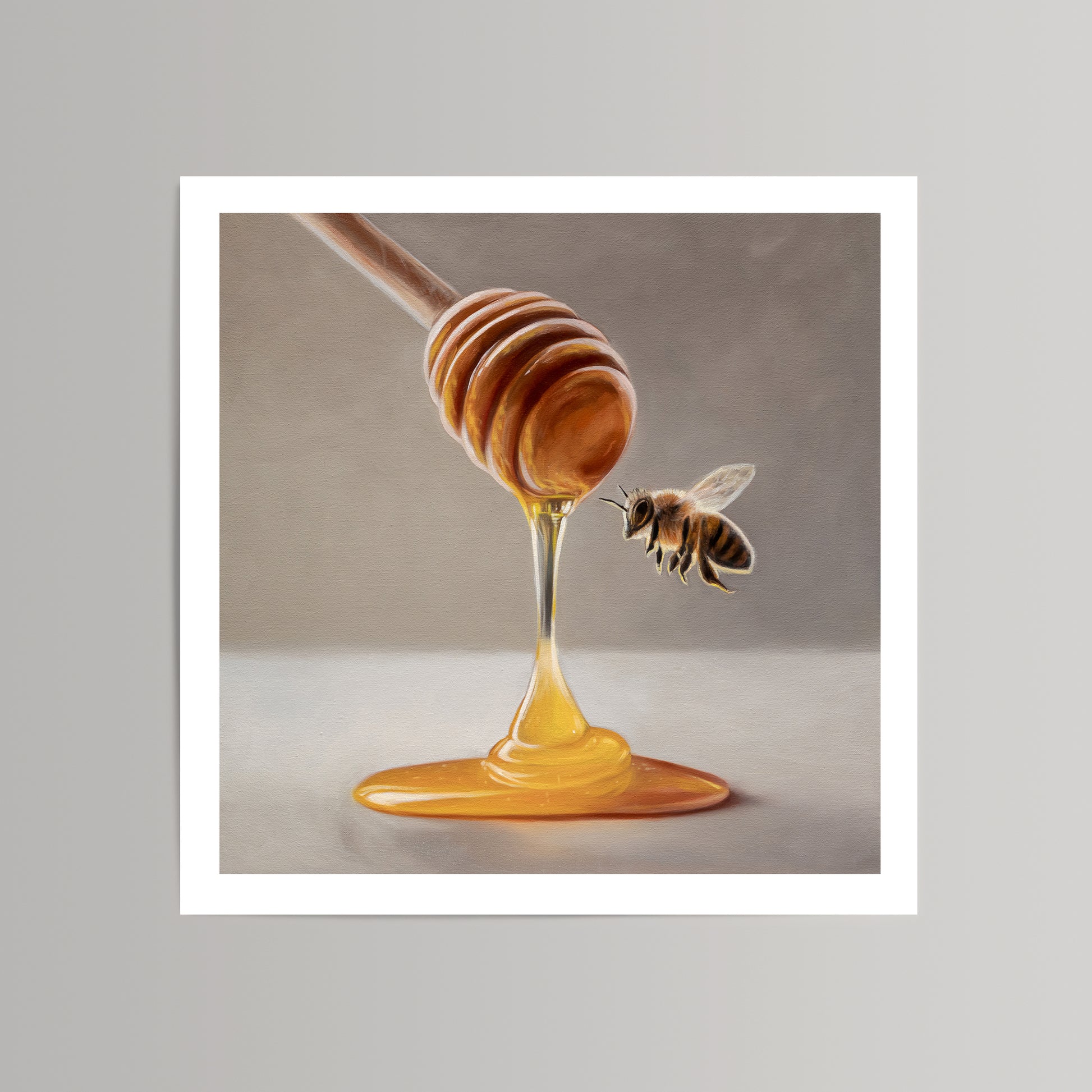 Fine art print of a wooden honey dipper dripping golden honey, with a bee flying towards it.