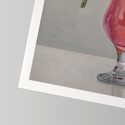 Fine art print of a pink cocktail in a glass, with a white border, on museum-grade cotton rag paper.