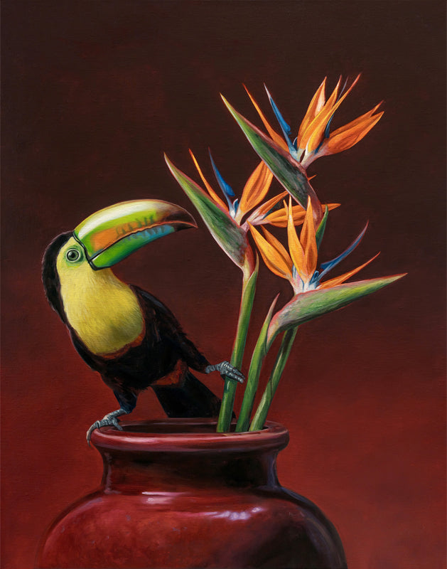 Vibrant Keel-billed Toucan perched on a deep red vase with orange Birds of Paradise flowers.