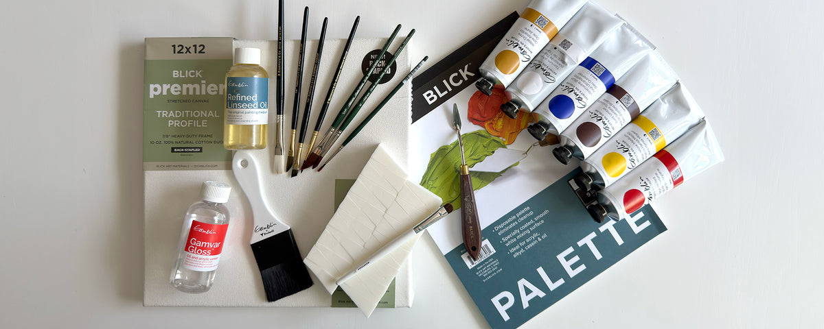 A flat display of various art materials including Gamblin oil paint, Blick paper palette, Blick canvas and various paint brushes.