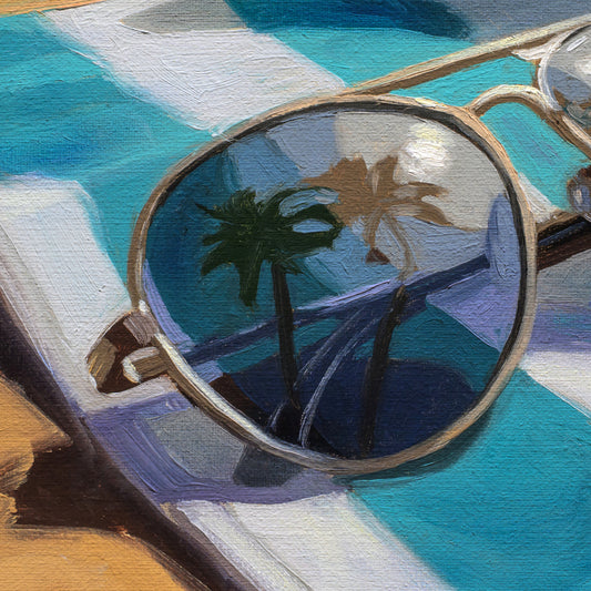 A close-up painted view of round sunglasses with thin gold-toned frames resting on a turquoise and white striped surface. The reflective lenses show palm trees and a bright light, rendered in an impressionistic style.