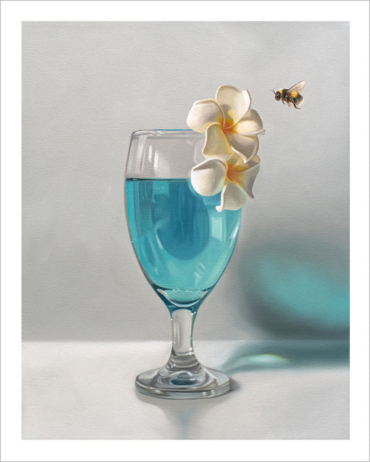 Fine art print of a blue cocktail in a glass with white plumeria flowers and a bumblebee on museum-grade cotton rag paper.