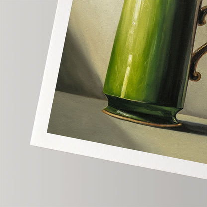 Fine art print of a glossy green mug on textured cotton rag paper with a clean white border.