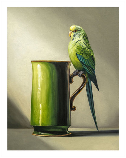 Fine art print of a green budgie perched on the handle of a glossy green ceramic mug against a soft, neutral background.