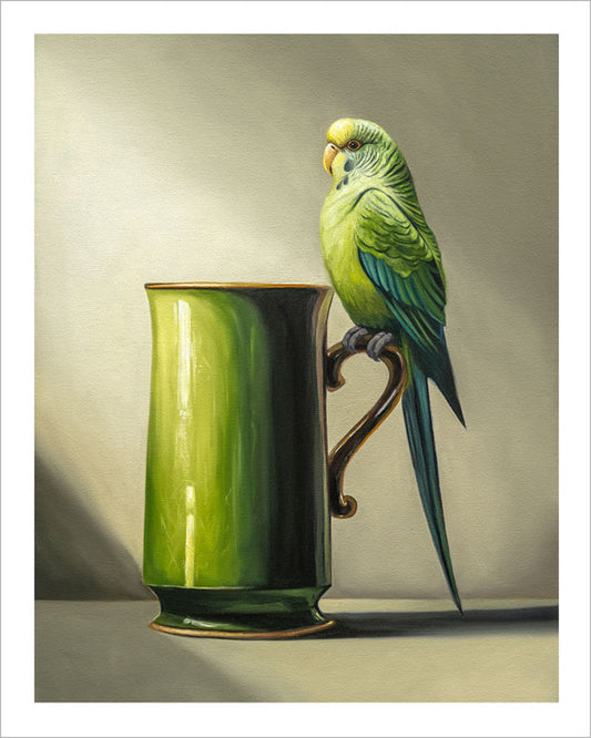 Fine art print of a green budgie perched on the handle of a glossy green ceramic mug against a soft, neutral background.