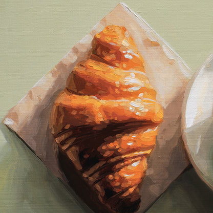 An oil painting of a golden-brown croissant resting on a square piece of white paper, set against a muted sage green background with a partial white plate visible on the right.