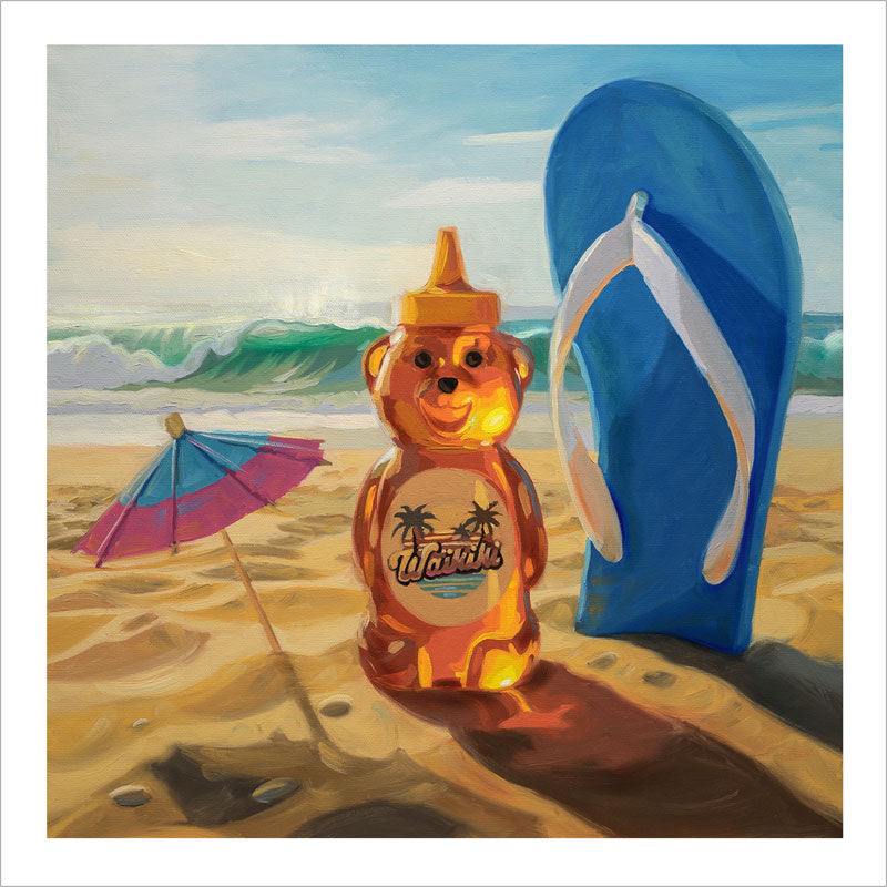 Fine art print of a honey bear, blue flip-flop, and cocktail umbrella on a sandy beach with a white border.