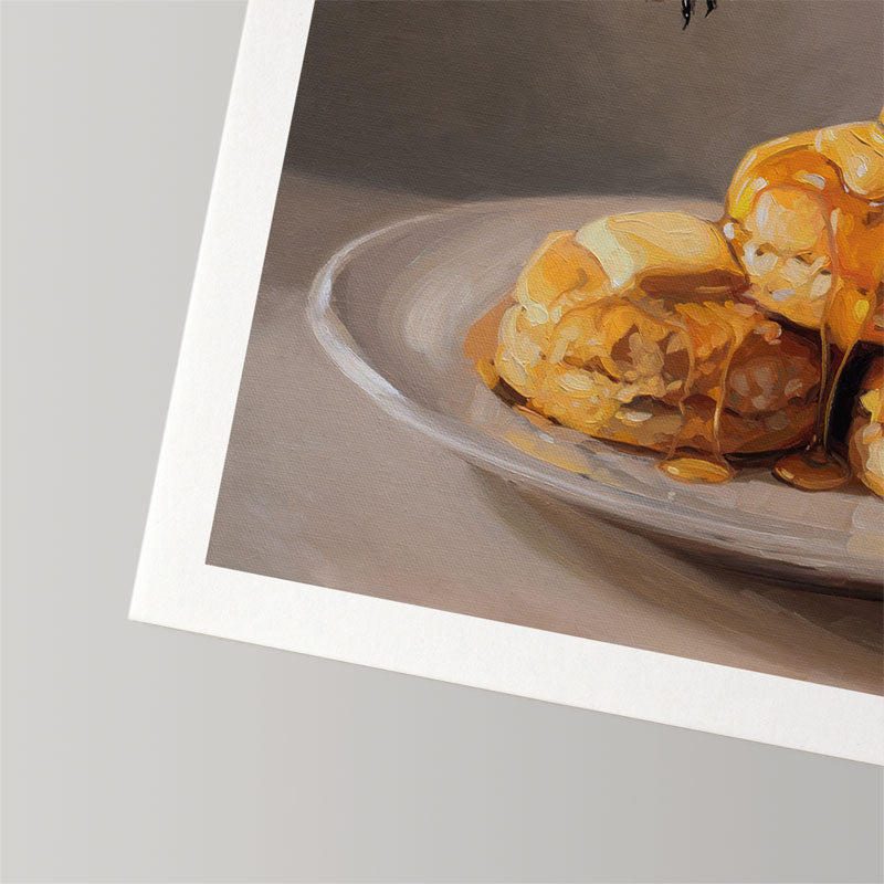 Fine art print of honey-drizzled biscuits on a plate, featuring a textured white border on museum-grade cotton rag paper.