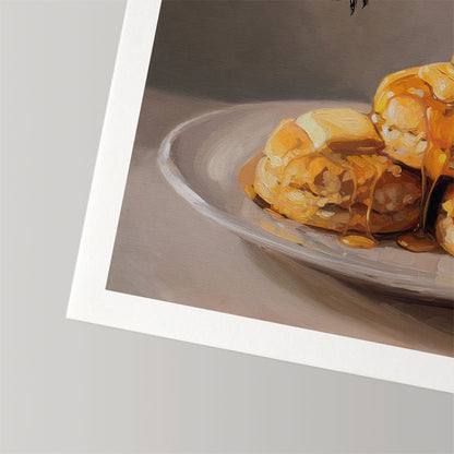 Fine art print of honey-drizzled biscuits on a plate, featuring a textured white border on museum-grade cotton rag paper.