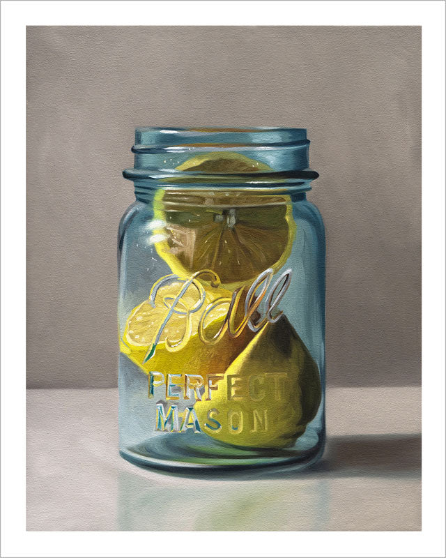 Fine art print of bright yellow lemons inside a vintage blue Ball mason jar on a neutral background with a white border.