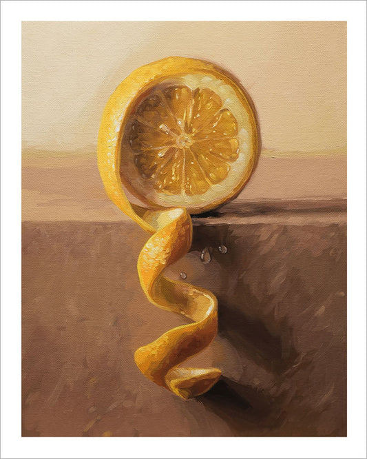 Archival fine art print of a bright yellow lemon half with a spiraling peel on a neutral shelf, set on white cotton paper.