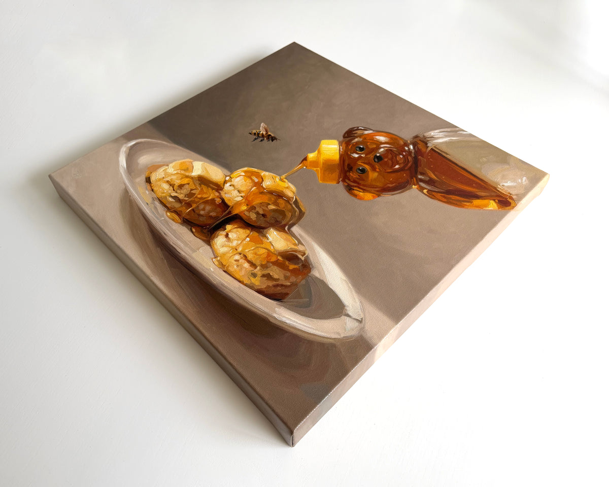 16x16 inch oil painting of warm biscuits drizzled with honey from a bear bottle, featuring a small bee on a neutral background.