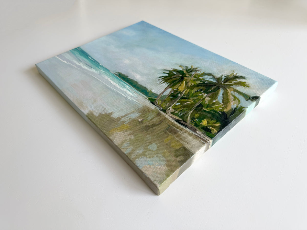 14x11 inch original oil painting on canvas featuring a serene beach scene with palm trees and reflective blue water.