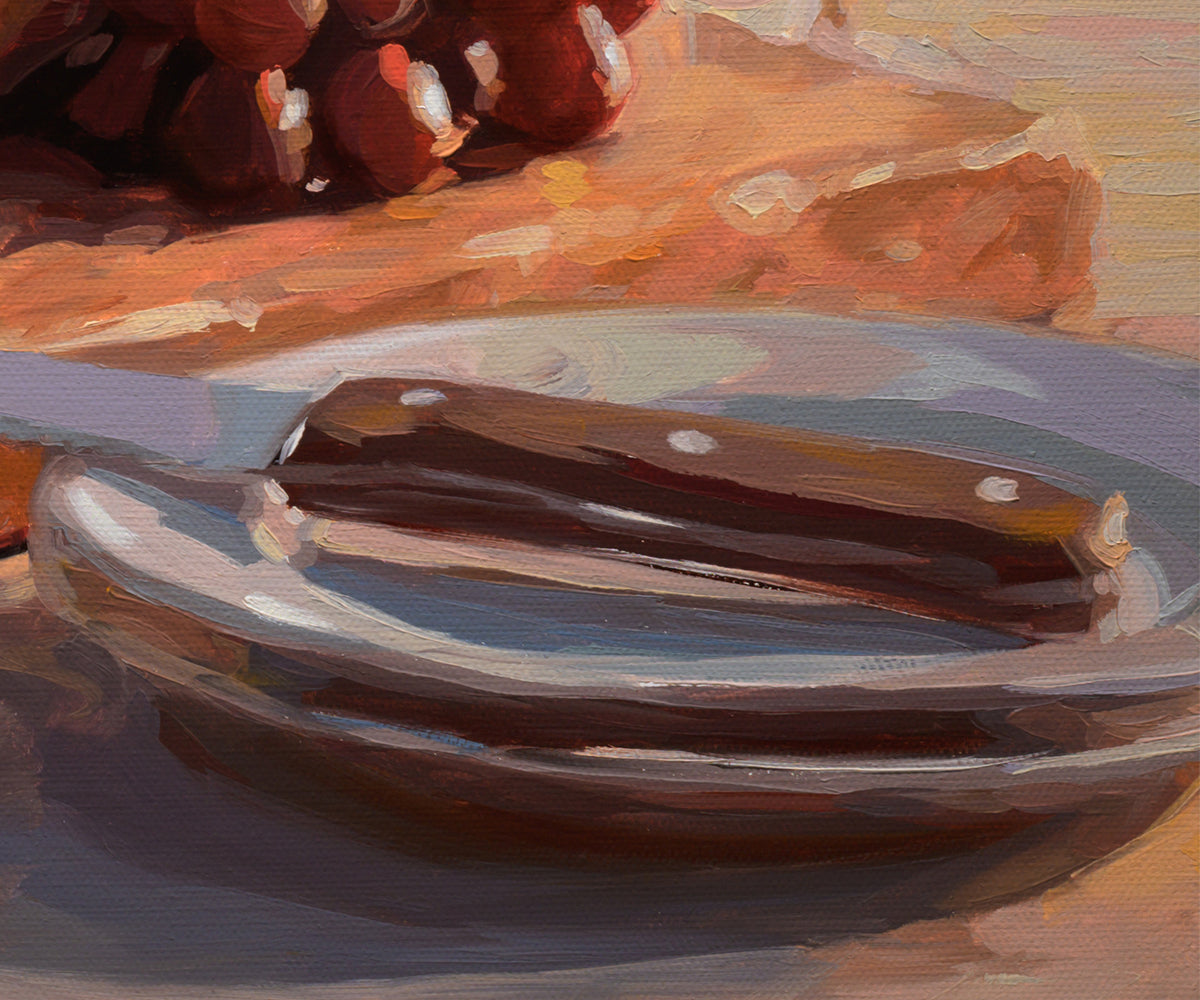 An oil painting depicting a close-up still life of a knife with a dark brown handle resting on a light-colored plate, with a warm-toned wooden surface and dark round objects in the background.