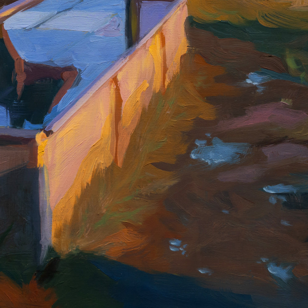 Close-up of a textured wall with abstract painting in warm colors