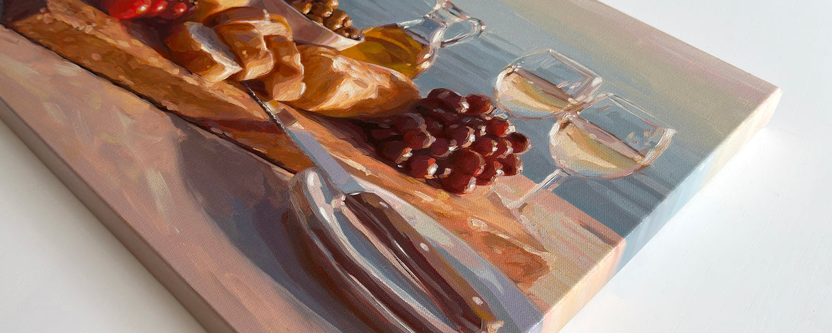 A painting featuring a charcuterie by the sea with bread, grapes, olives, olive oil and champagne.