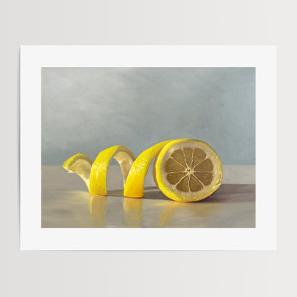 Lemon Twist Fine Art Print by Lauren Pretorius: a lemon half with its peeling spiraling out towards the left on a light, reflective surface and muted blue background.