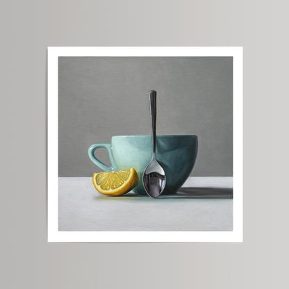Still life art print: a vibrant lemon wedge, a teal cup, and a silver spoon on a white surface.
