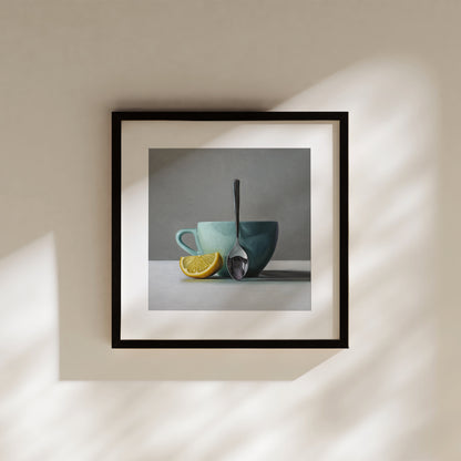 Framed still life fine art print featuring a lemon wedge, a teal cup, and a silver spoon.