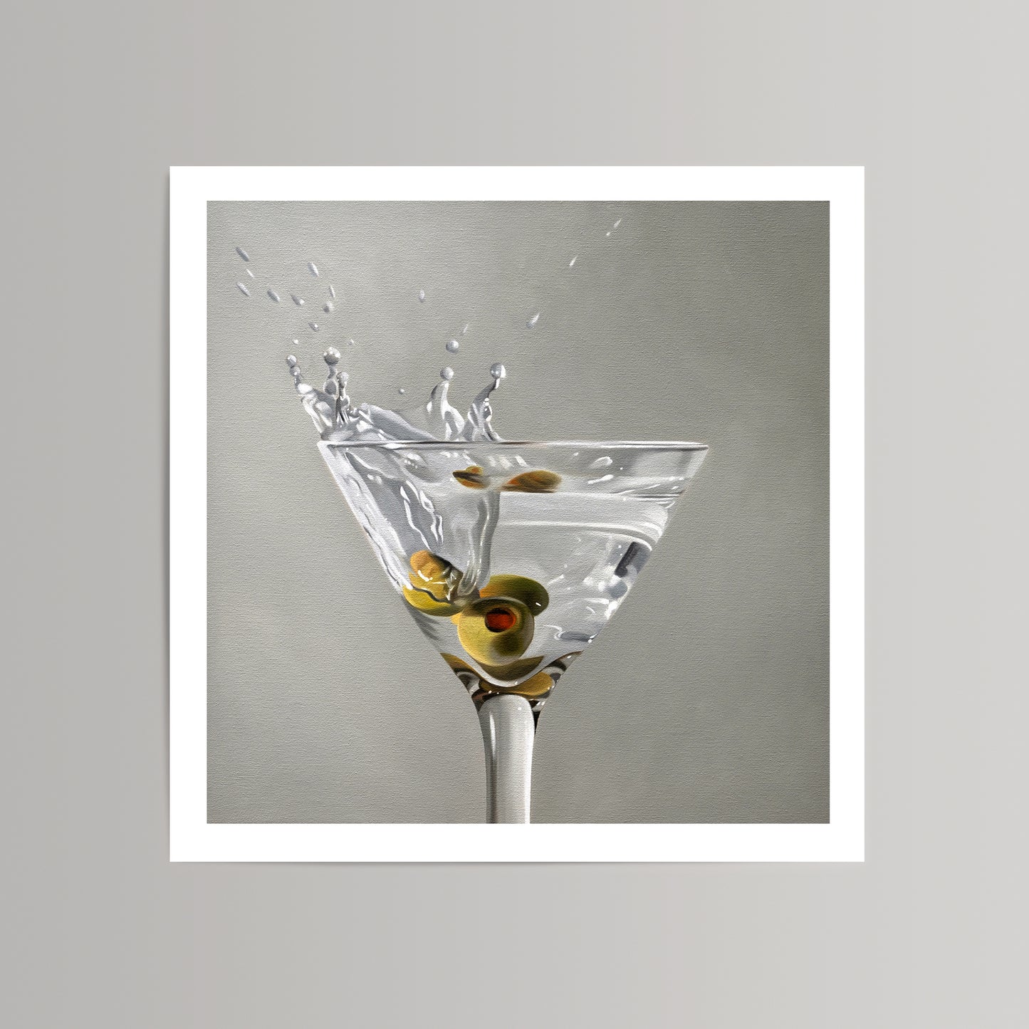 Martini Splash fine art print with three green olives in a clear glass, liquid splashing.