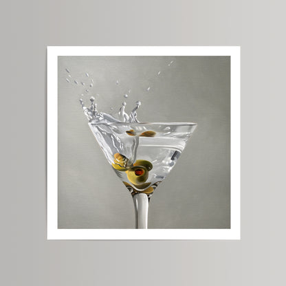 Martini Splash fine art print with three green olives in a clear glass, liquid splashing.