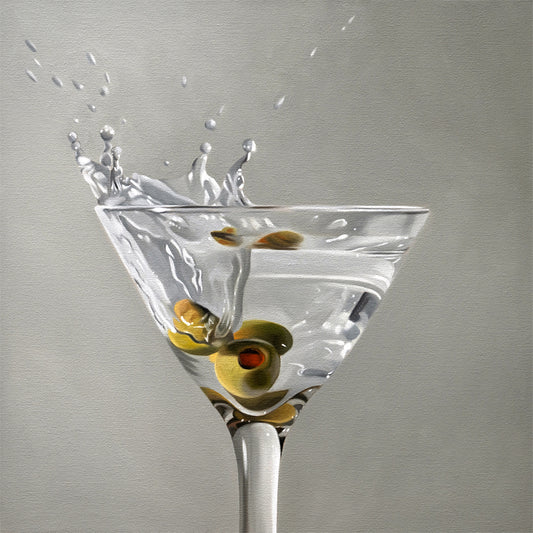 Realistic fine art print of a martini glass with green olives and a dramatic splash on a gray background.