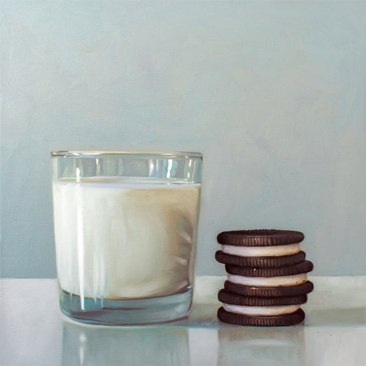 Milk and Cookies Fine Art Print by Lauren Pretorius: a glass of milk and a trio of Double Stuff Oreos on a light, reflective surface with dramatic lighting and cast shadows.