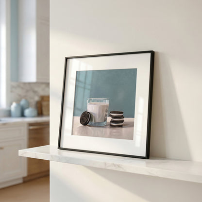 Framed fine art print of a glass of milk with Oreo cookies on a light surface against a blue wall.