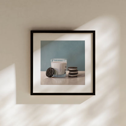 Framed fine art print of a glass of milk with Oreo cookies against a blue background.